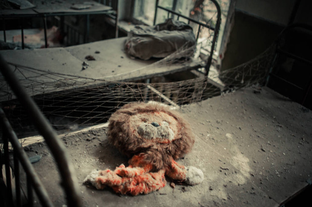 Abandoned kindergarden in Prypiat Chernobyl Exclusion Zone Toys, Dolls and Books left in building - Photo, Image