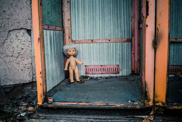 Old abandoned soviet doll in the telephone booth in Chernobyl - Photo, Image