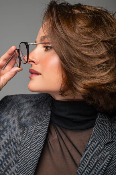 Beautiful business woman brunette with bob haircut in eyeglasses. - Fotografie, Obrázek