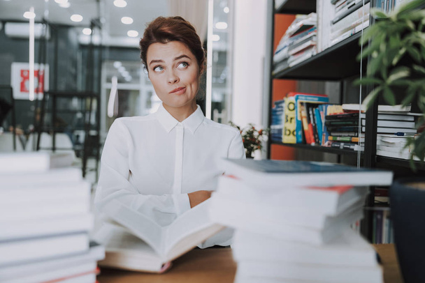 Curious dreamy woman in the office stock photo - Фото, зображення