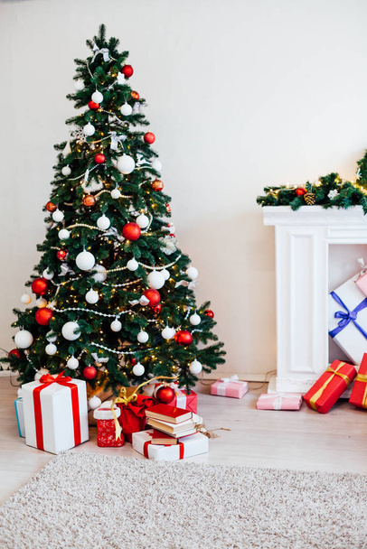 Christmas tree with Garland decoration and gifts for the new year - Photo, Image
