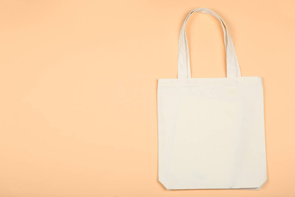 White cotton eco bag on beige background - Φωτογραφία, εικόνα