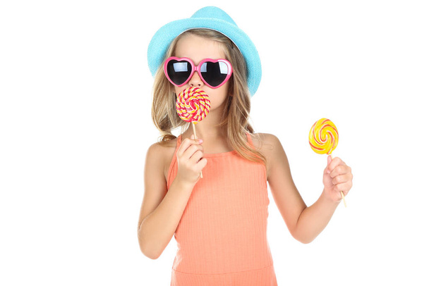 Young girl with lollipops on white background - Foto, imagen