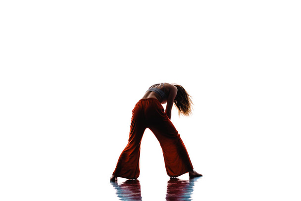 Attractive stylish woman practicing modern dance choreography - Foto, Bild