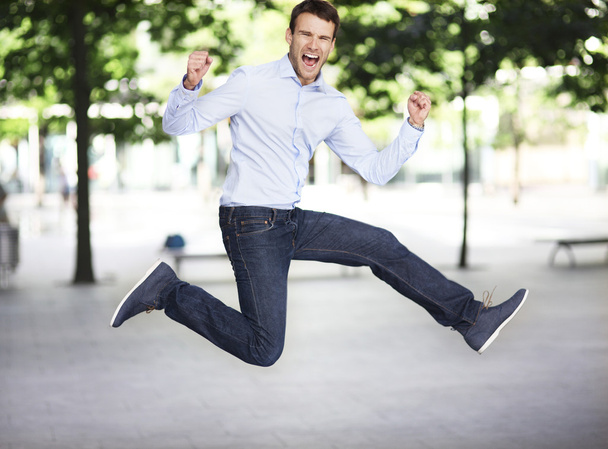 Man jumping with joy - Foto, afbeelding