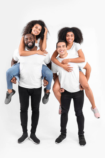 Portrait of young African-American people on white background - Fotó, kép