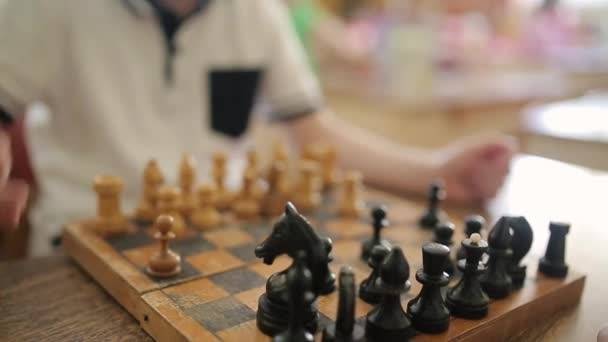 Children play chess. Children play educational games in a preschool. - Imágenes, Vídeo