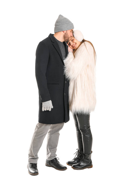 Portrait of happy couple in winter clothes on white background - Photo, Image