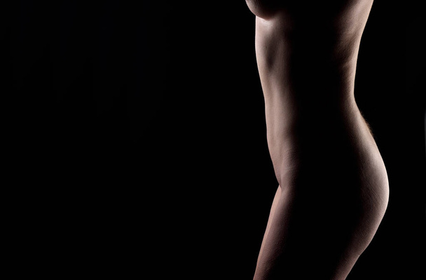 middle aged woman nude on black background - Photo, Image