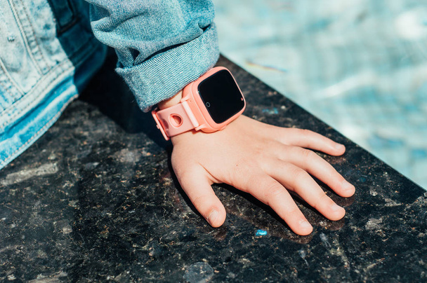 Smart watch on the childs hand. close-up - Photo, image