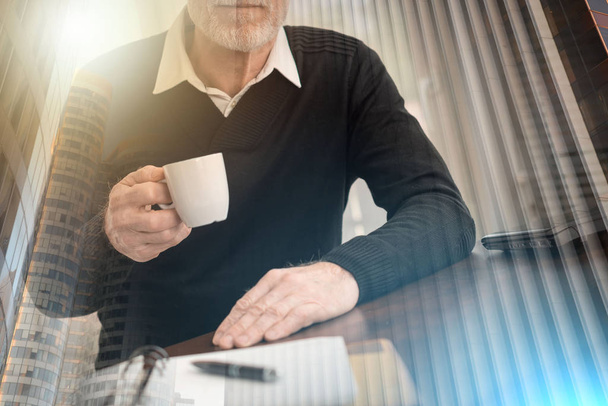 Businessman having coffee break; multiple exposure - Photo, Image