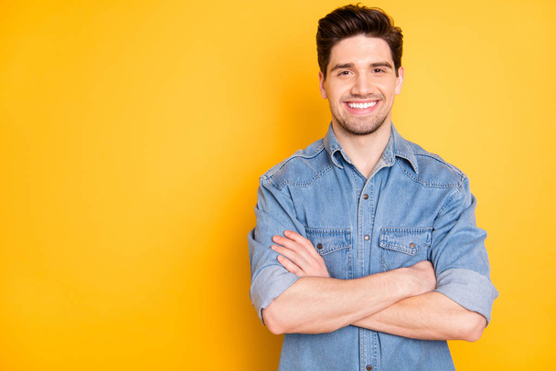 Photo of cheerful positive man standing confidently smiling toothily with hands folded isolated bright color background - Photo, Image