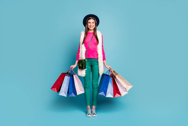 Full length body size view of her she nice attractive lovely cheerful cheery girl carrying new things clothing isolated on bright vivid shine vibrant green blue turquoise color background - Fotoğraf, Görsel