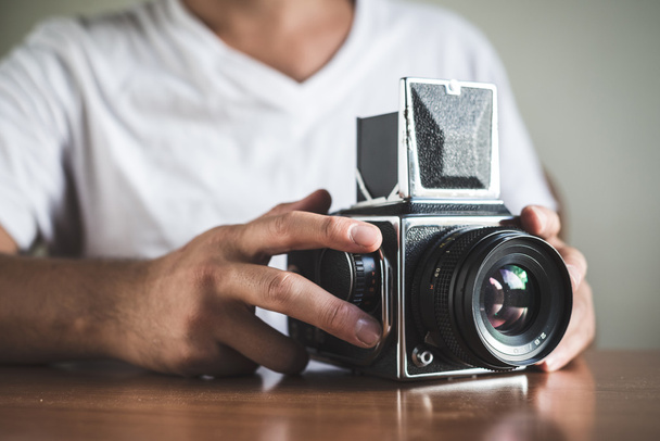 young stylish hipster man with old camera - Foto, imagen