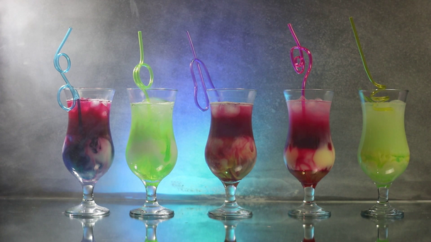 New Year and Christmas party concept. Different tasty cocktails with creative New Year holiday artwork decoration on background. Colorful cocktail in glass. Party club entertainment. Copy  - Footage, Video