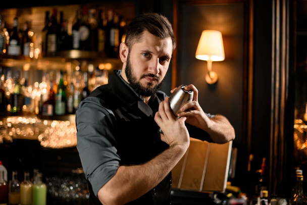 Portrait of a male bartender with shaker - Fotoğraf, Görsel