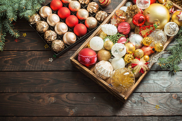 Christmas balls in box on dark wooden background  - Photo, image