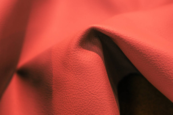 classic coral colored trend for your design. Copy space. COY2020. Coral leatherette fabric texture - Photo, Image
