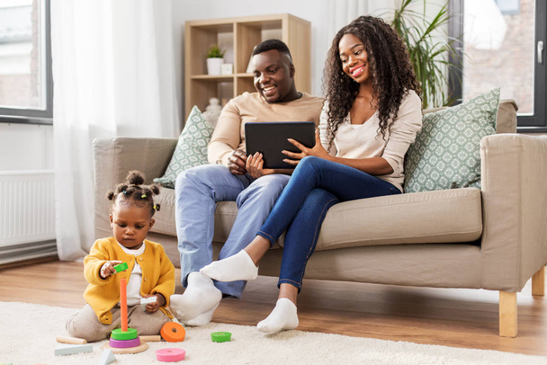 family with tablet pc and toy blocks at home - Foto, Imagem