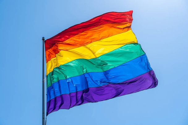 Rainbow gay pride flag on a blue sky - Foto, immagini