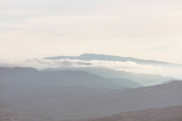Mountains silhouette  in Cyprus in the misty morning - Fotoğraf, Görsel