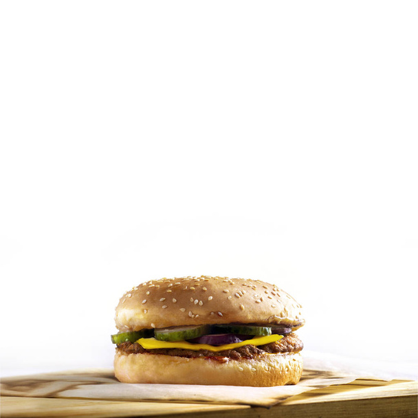 burger on a wooden board on a white background - 写真・画像