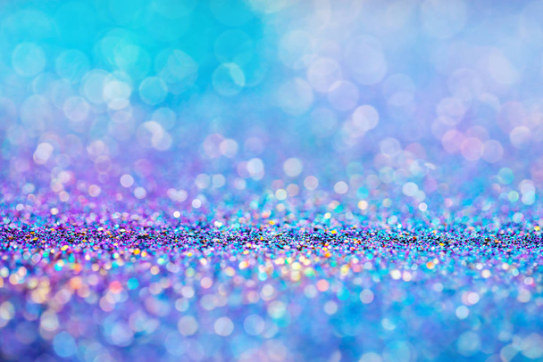 Shiny multicolor glitter raster background. Abstract shimmering pink, blue, yellow circles decorative backdrop. Bokeh lights effect illustration. Overlapping glowing and twinkling spots. - Photo, Image
