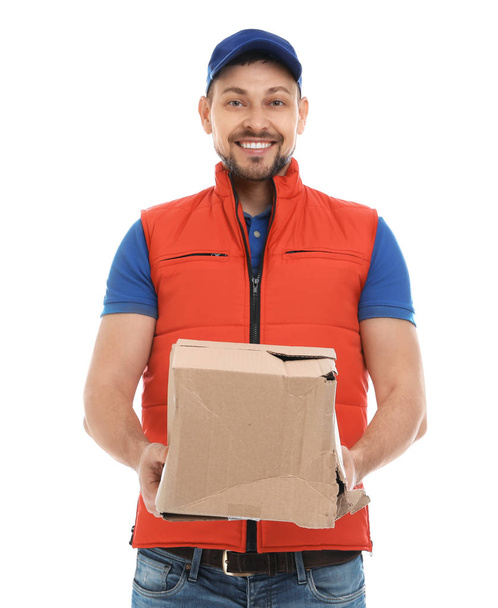 Courier with damaged cardboard box on white background. Poor quality delivery service - Фото, зображення
