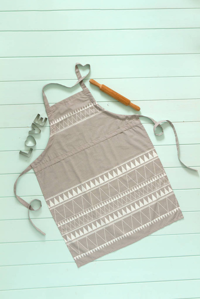 kitchen apron of gray color with a heart on the outfits - Photo, Image