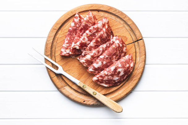 Sliced salami. Sausage meat. - Фото, изображение