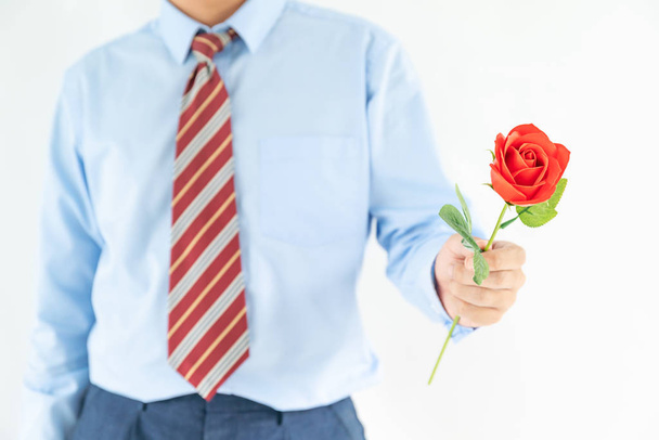 Man holding with red rose on white background - Foto, Imagem