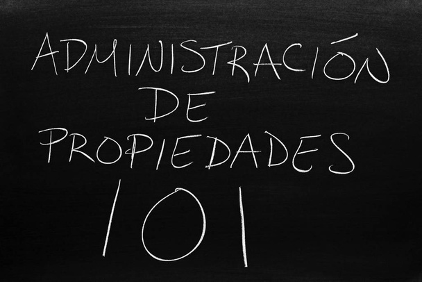 The words Administracin De Propiedades 101 on a blackboard in chalk.  Translation: Property Mangement 101 - Photo, Image