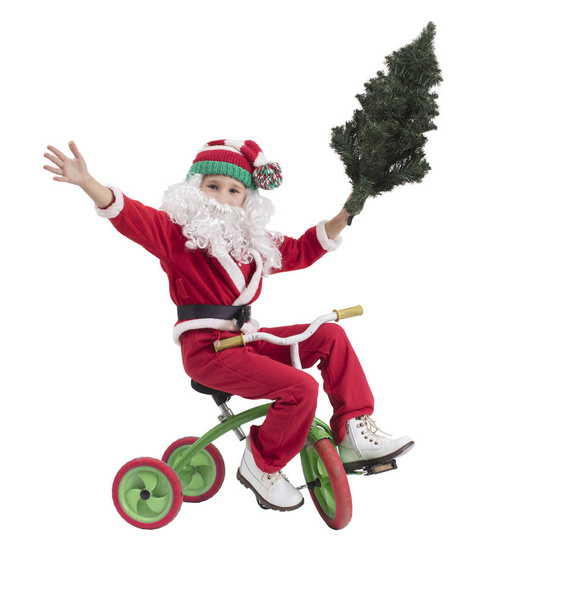 自転車でサンタクロースの男の子。クリスマス休暇の概念。クリスマスの子 - 写真・画像