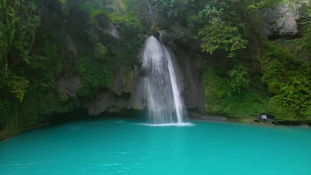 Kawasan Falls in a mountain gorge at the tropical jungle of Cebu Island in Philippines. Waterfall landscape and green tropic nature in Asia - Footage, Video
