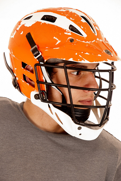 male lacrosse player close up head shot with helmet - Fotó, kép