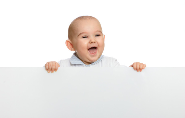 Cute baby boy holding empty blank board - 写真・画像