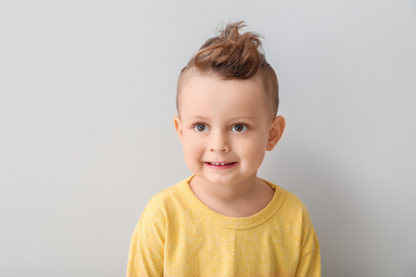 Portrait of cute little boy on light background - Fotografie, Obrázek
