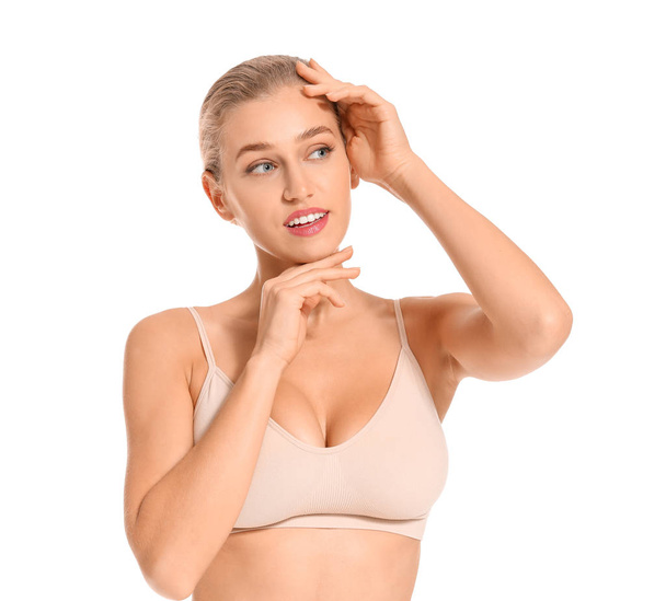 Beautiful young woman in underwear on white background - Fotó, kép