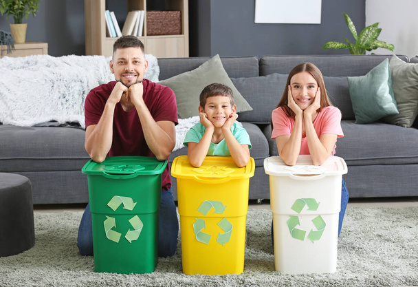 Family with containers for garbage at home. Concept of recycling - Photo, Image