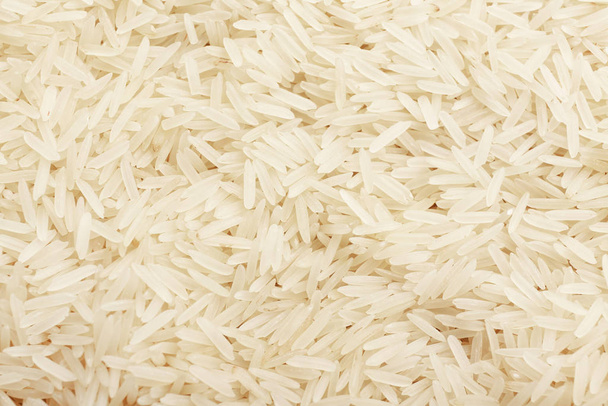 Heap of raw rice as background - Photo, Image