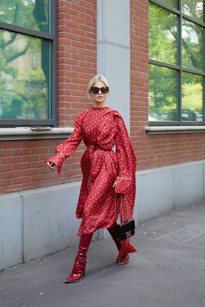 Caro Daur with red Fendi dress with before Fendi fashion show, Milan Fashion Week street style  - Zdjęcie, obraz