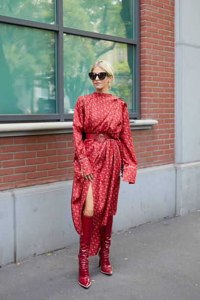 Caro Daur with red Fendi dress with before Fendi fashion show, Milan Fashion Week street style  - Фото, изображение