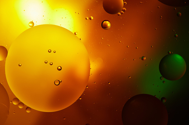 abstract orange and green color background from mixed water and oil  - Photo, Image