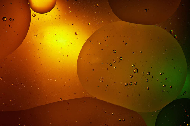 Beautiful orange color abstract background from mixed water and oil   - Photo, image