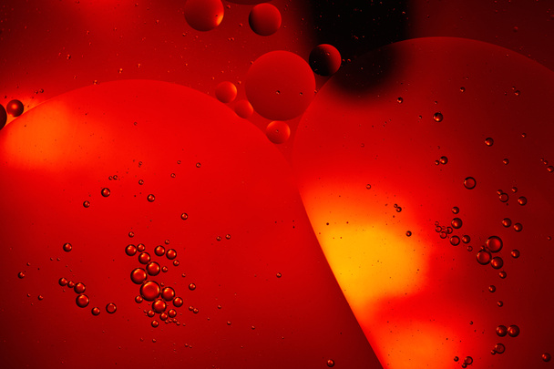 creative abstract red color background from mixed water and oil bubbles - Foto, immagini