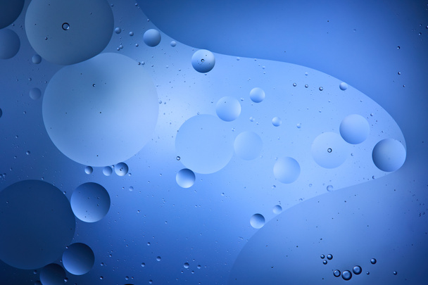 Beautiful color abstract background from mixed water and oil in blue color - Photo, Image