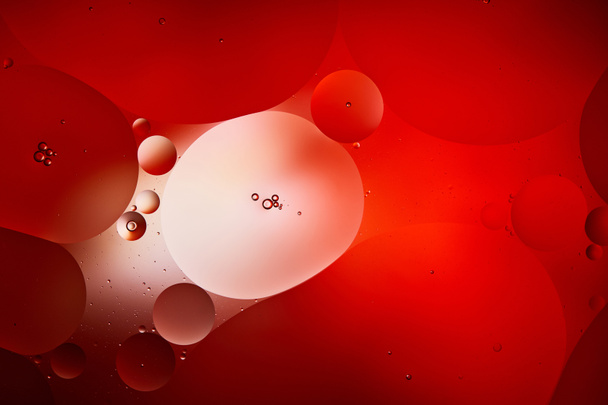 abstract red color background from mixed water and oil bubbles - Photo, Image
