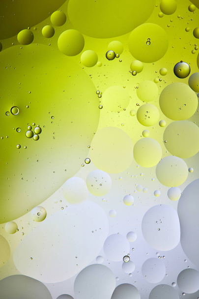abstract green and grey color background from mixed water and oil bubbles  - Photo, Image