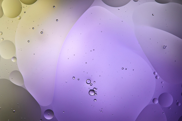 creative purple and green color abstract background from mixed water and oil bubbles - Fotoğraf, Görsel