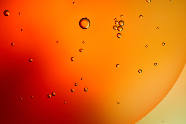 abstract orange and red color background from mixed water and oil  - Photo, Image